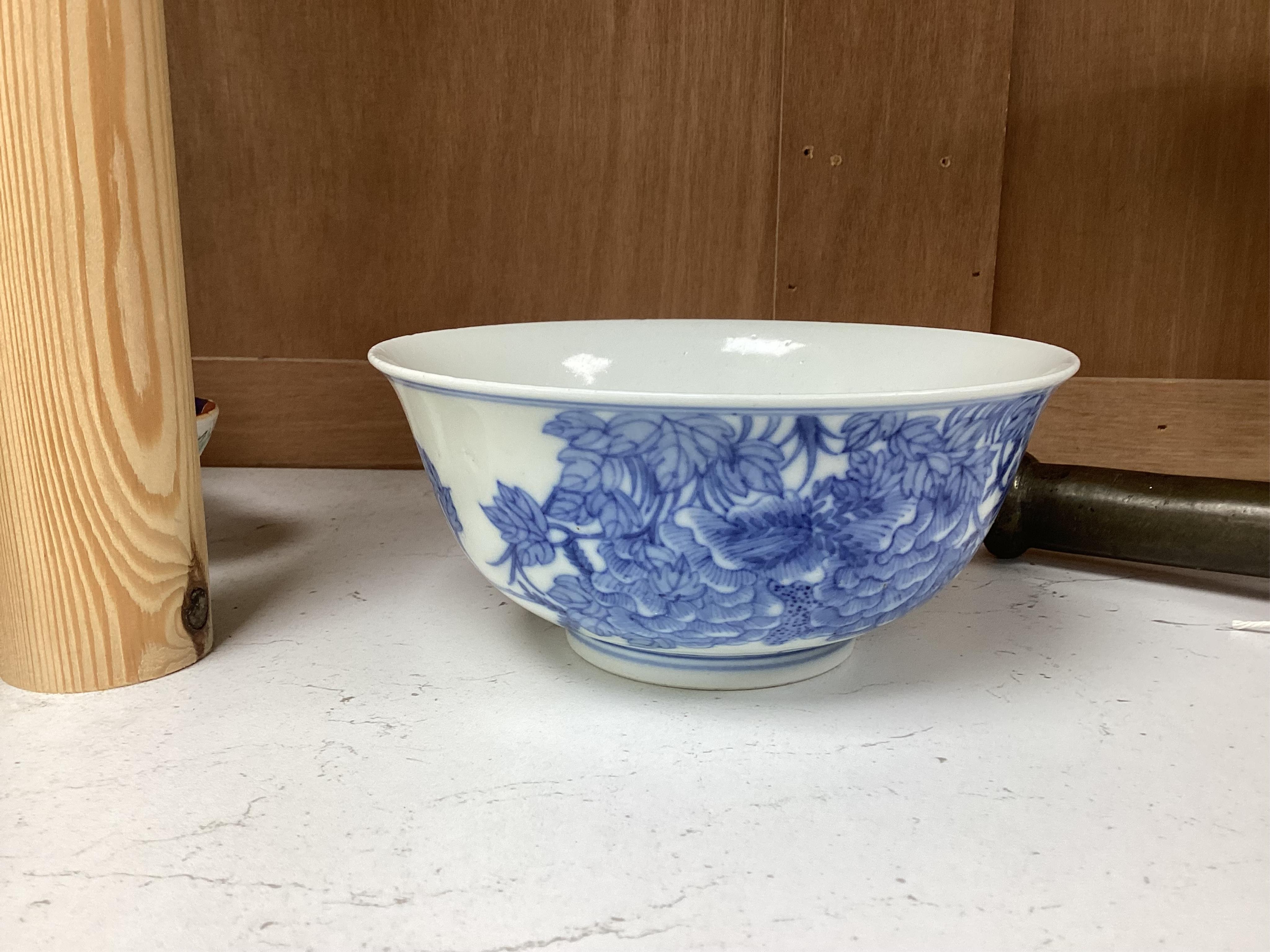 A Chinese blue and white bowl, decorated with flowers and birds, 14.5cm in diameter